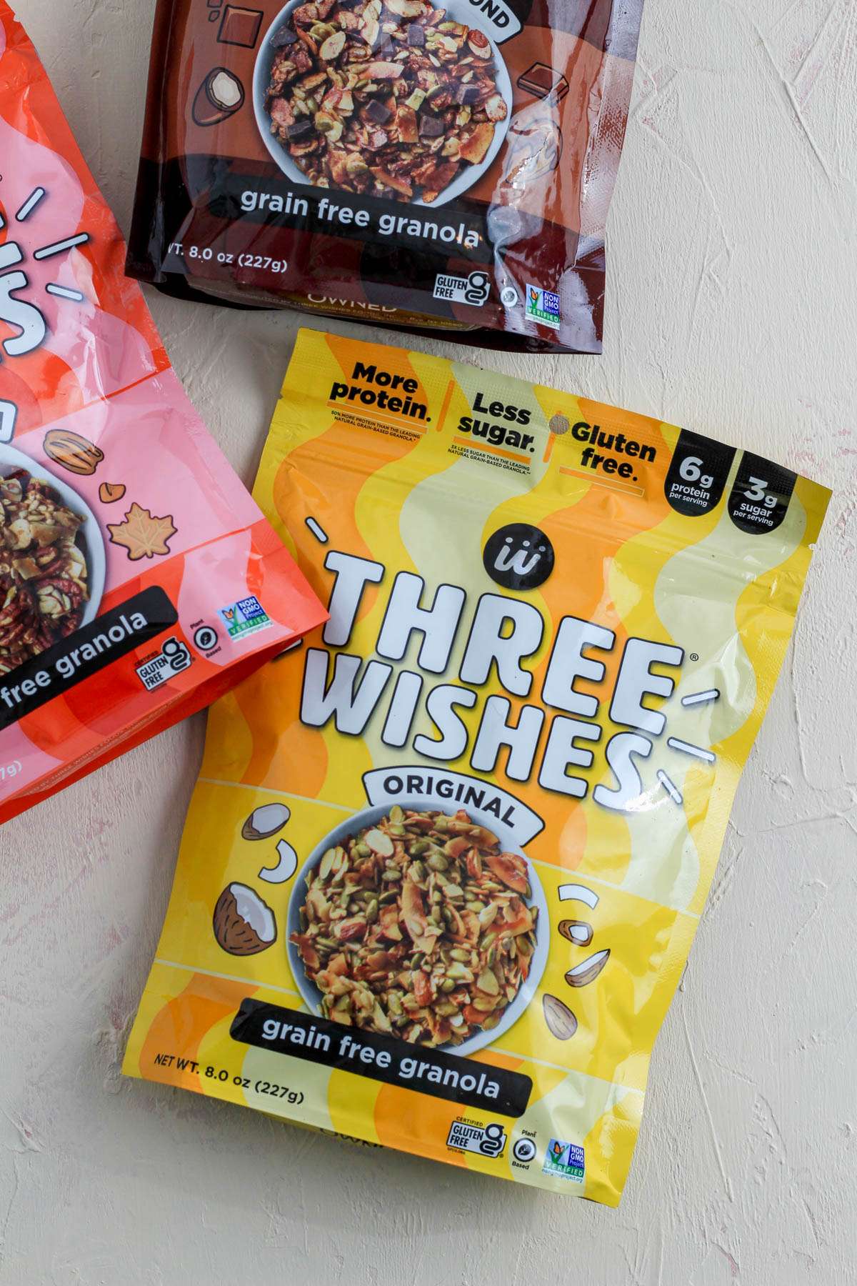 A close up shot of Three Wishes Original Grain Free Granola in a yellow package.