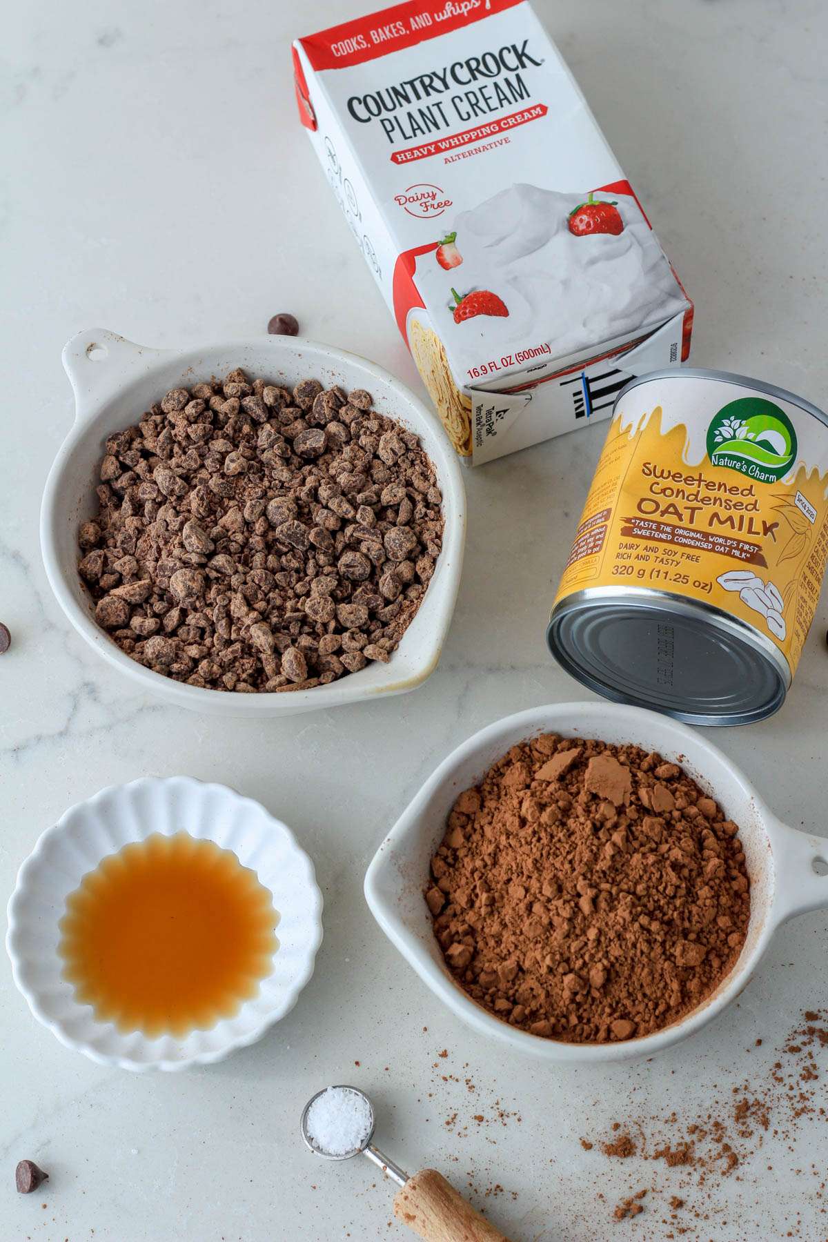 Ingredients for vegan chocolate chocolate chip ice cream on a cream counter.