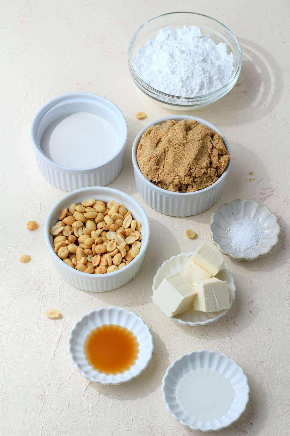 Ingredients for vegan peanut pralines on a cream counter.