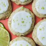 A close up of a soft vegan lime cookie on a pink plate.