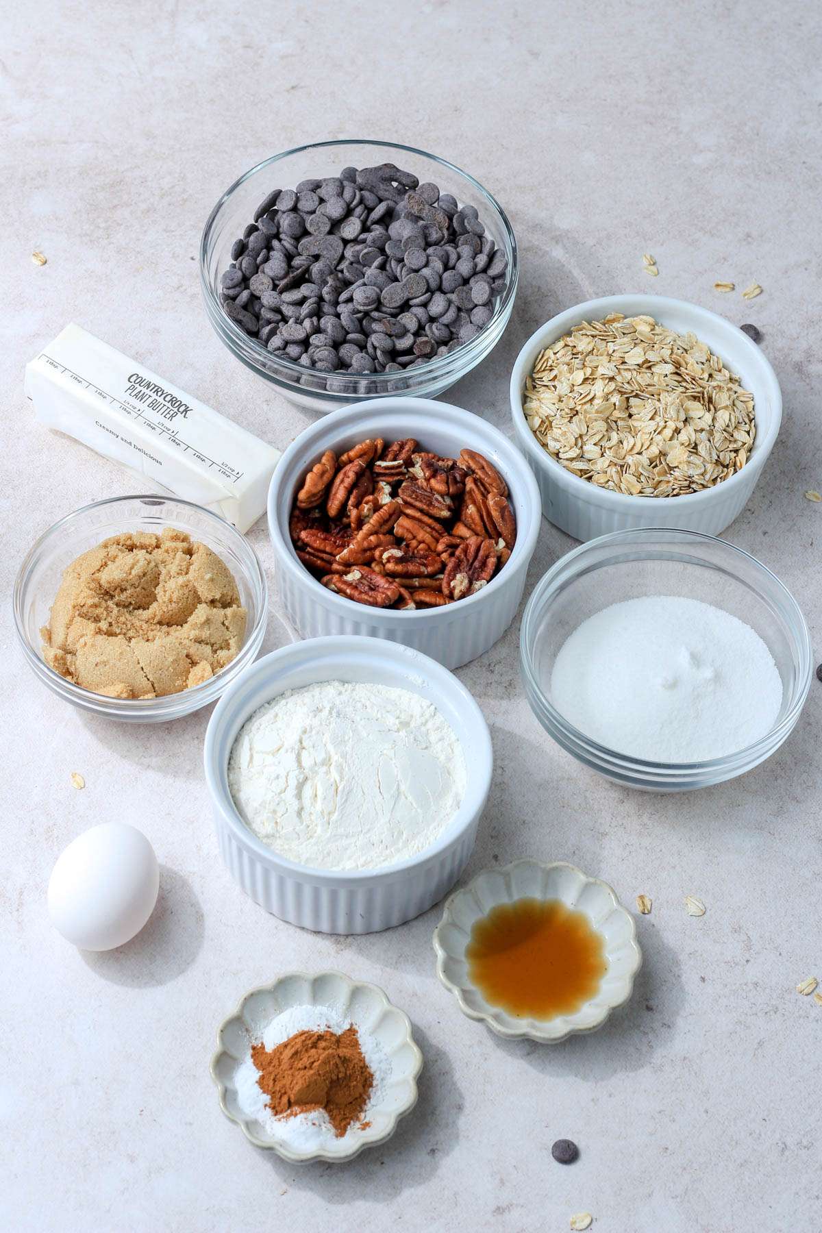 Ingredients for cowboy cookies on a cream counter.
