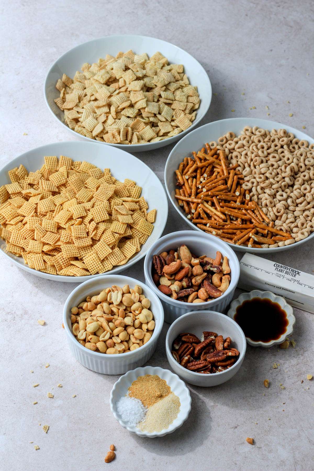 Ingredients for dairy-free chex party mix on a counter.