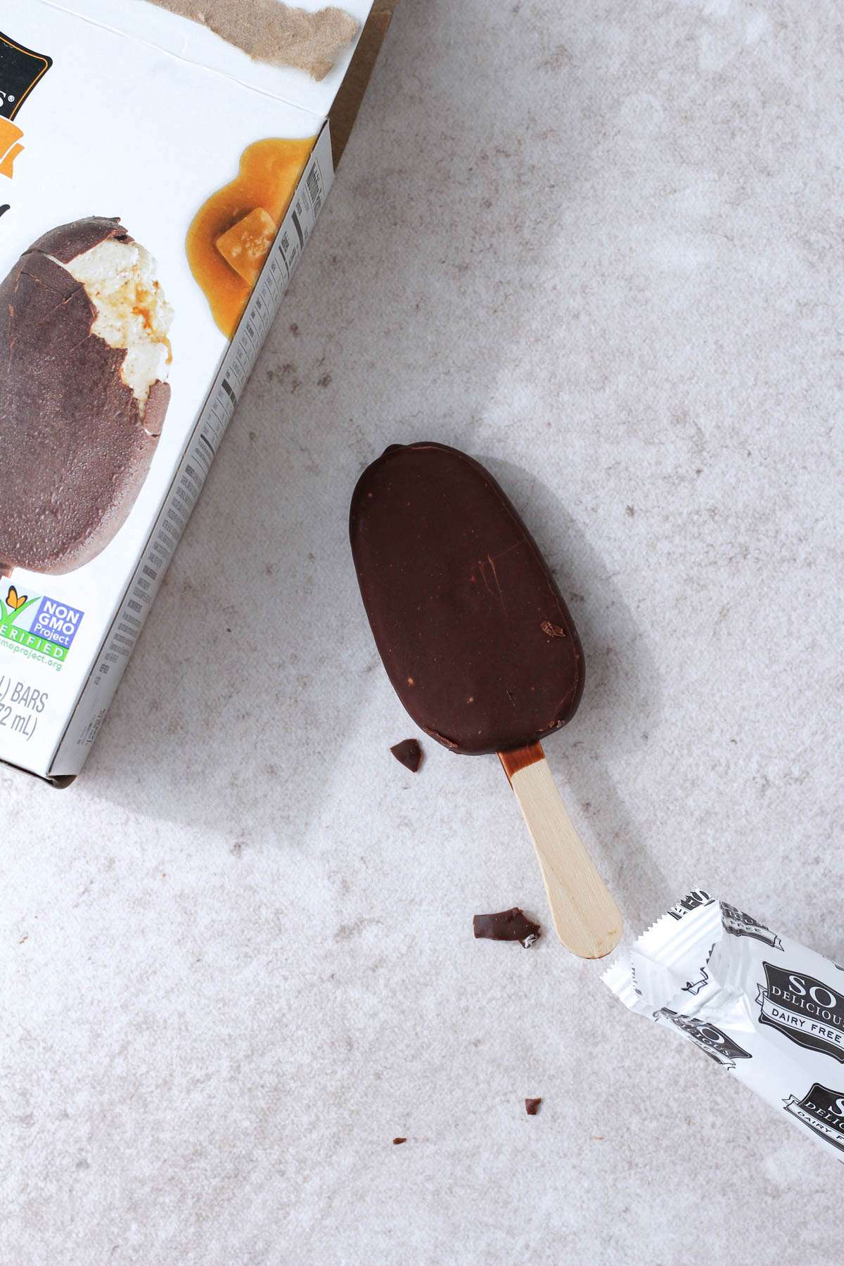 A so delicious ice cream bar on the counter by the salted caramel box.