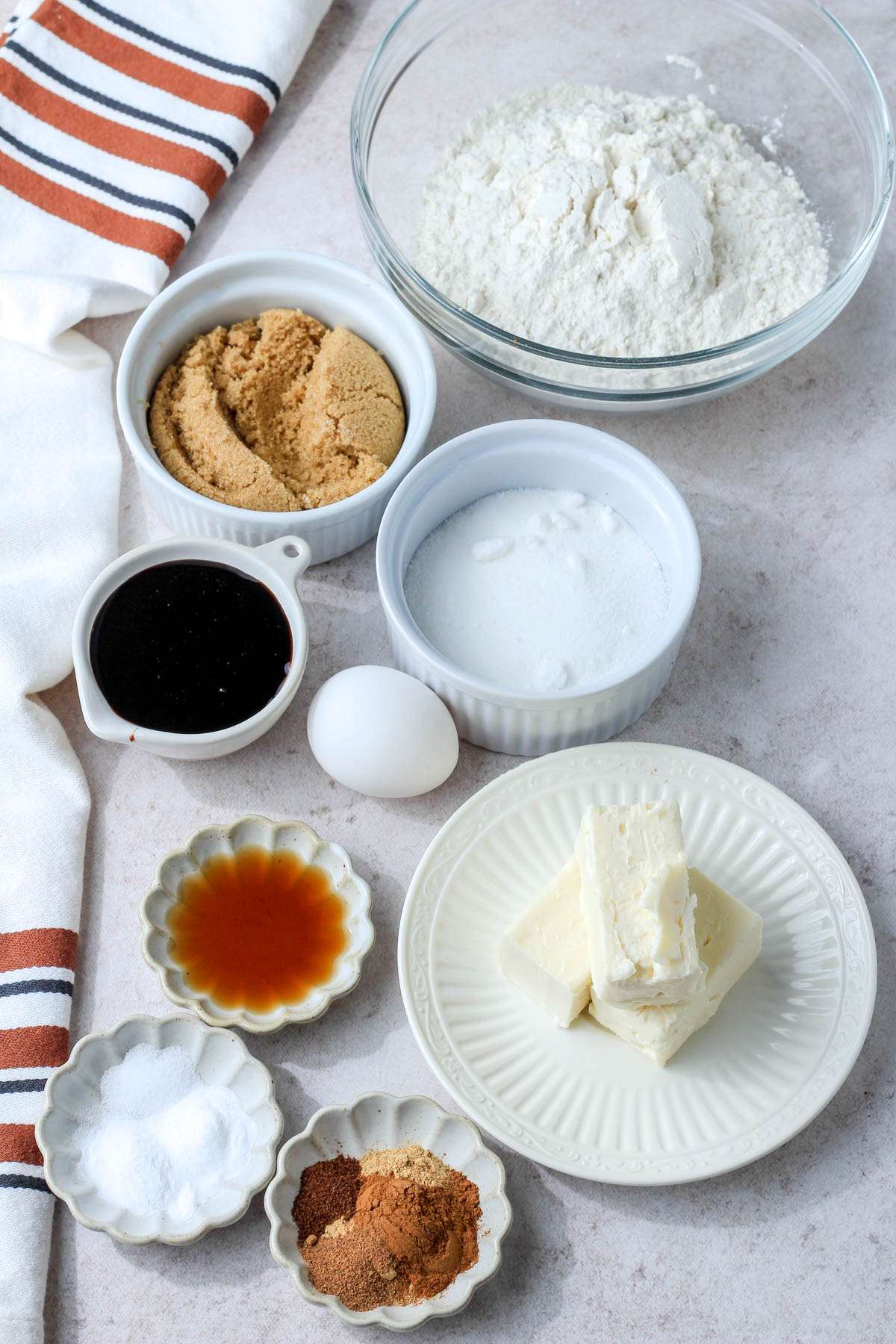 Ingredients for soft ginger cookies on a tan counter.