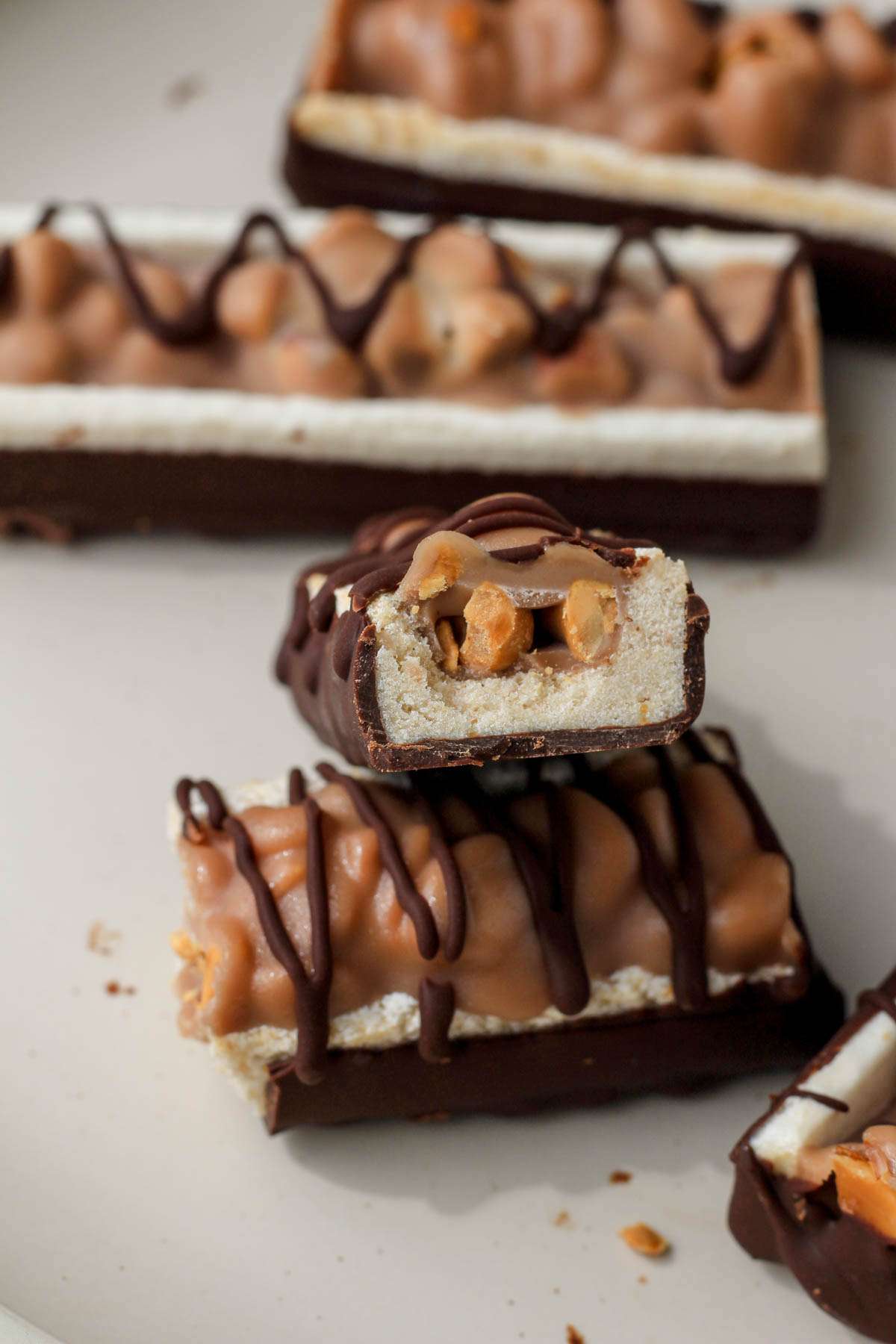 A sliced open kind frozen peanut bar to show the fillings.