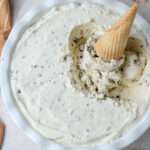A white pie dish with vegan drumstick ice cream and an ice cream cone sticking out of the top right of the pan.