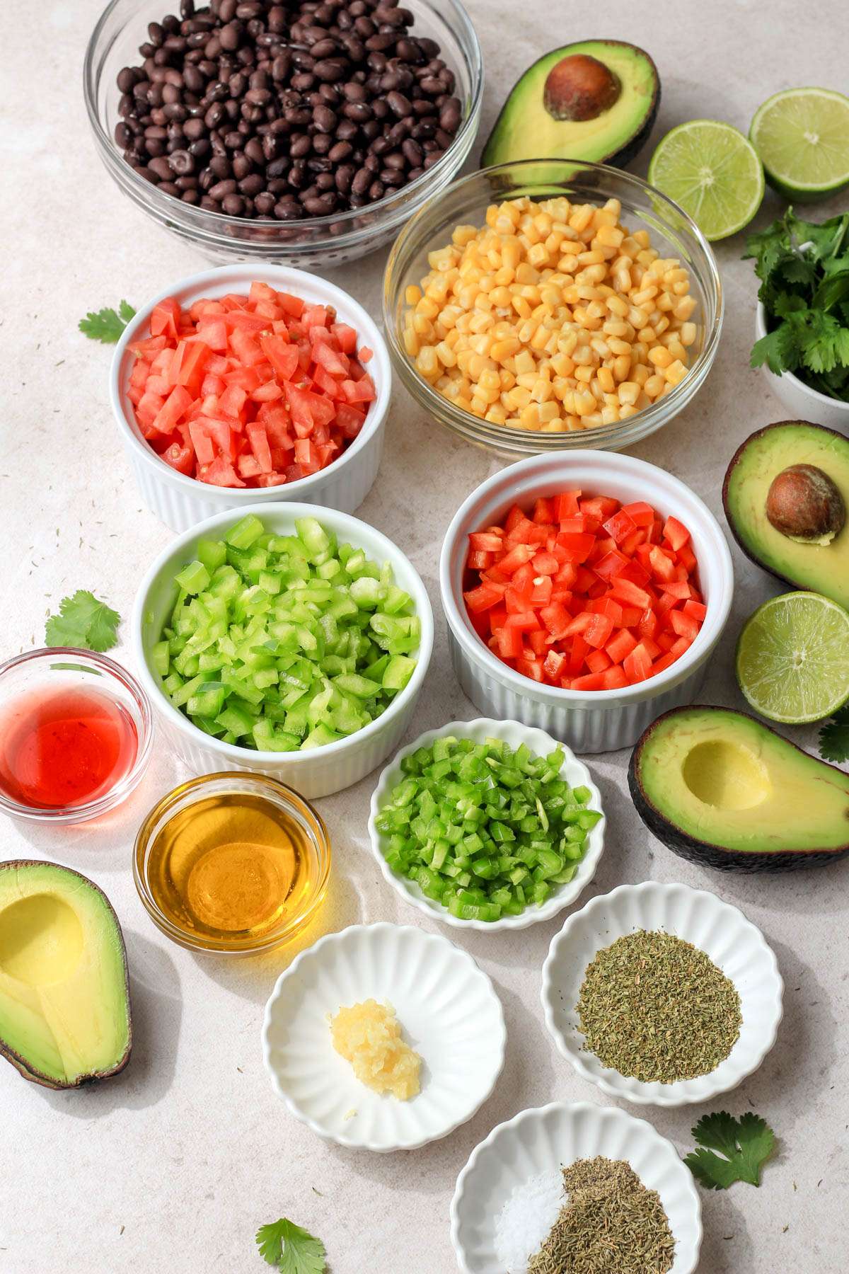 Ingredients for Texas Caviar on a tan counter.