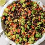 A deep white dish of Texas caviar with a silver spoon.