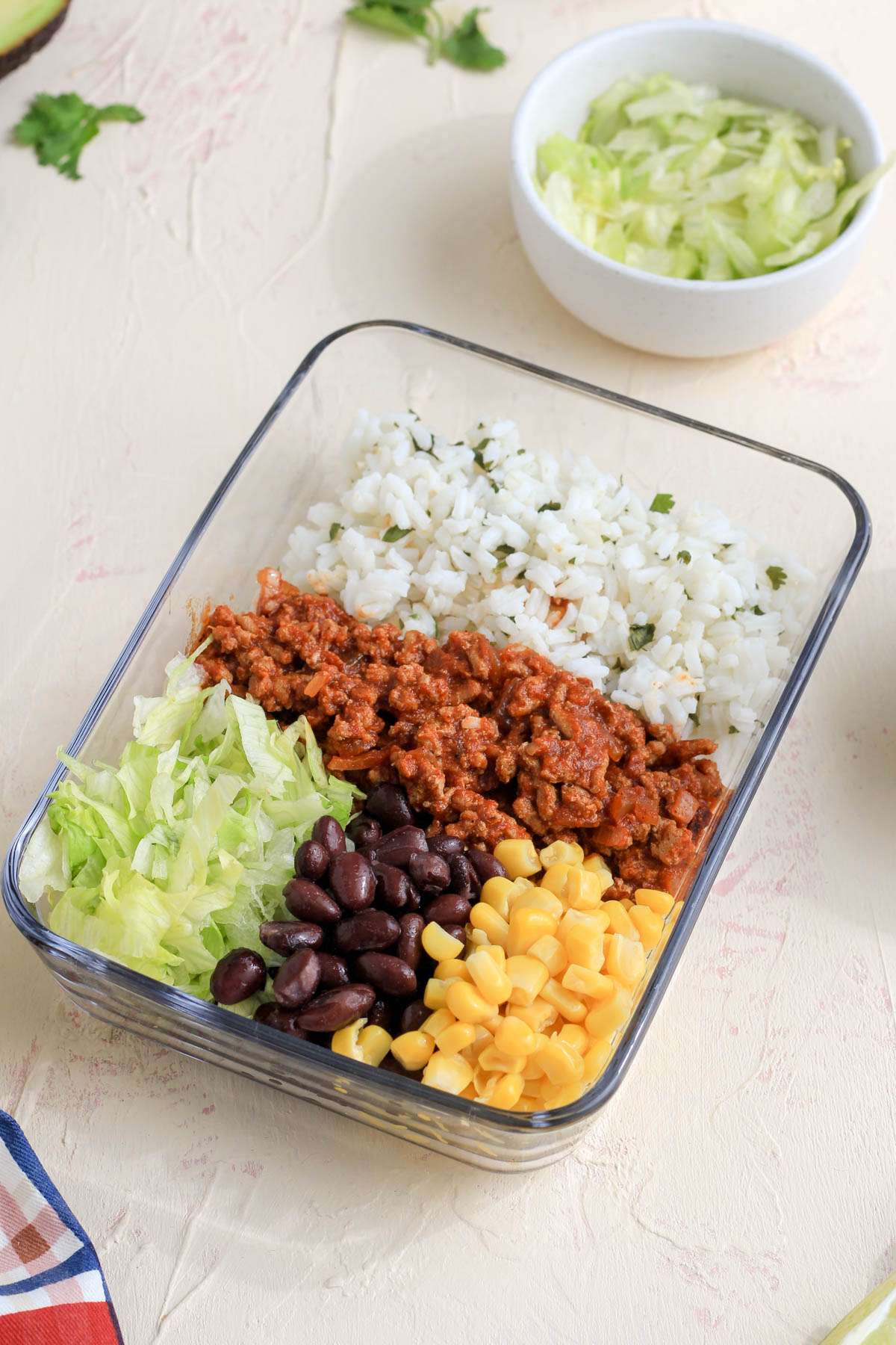 A glass pyrex with a ground turkey taco lunch bowl prepped for later.