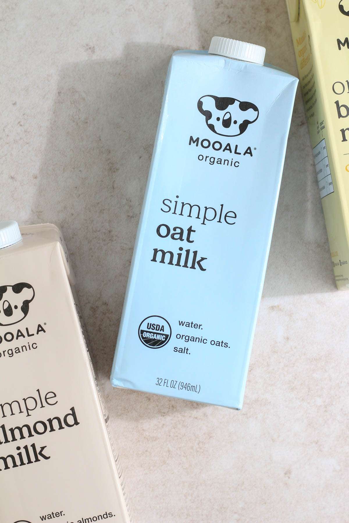 A blue carton of Simple Oat Milk by Mooala.