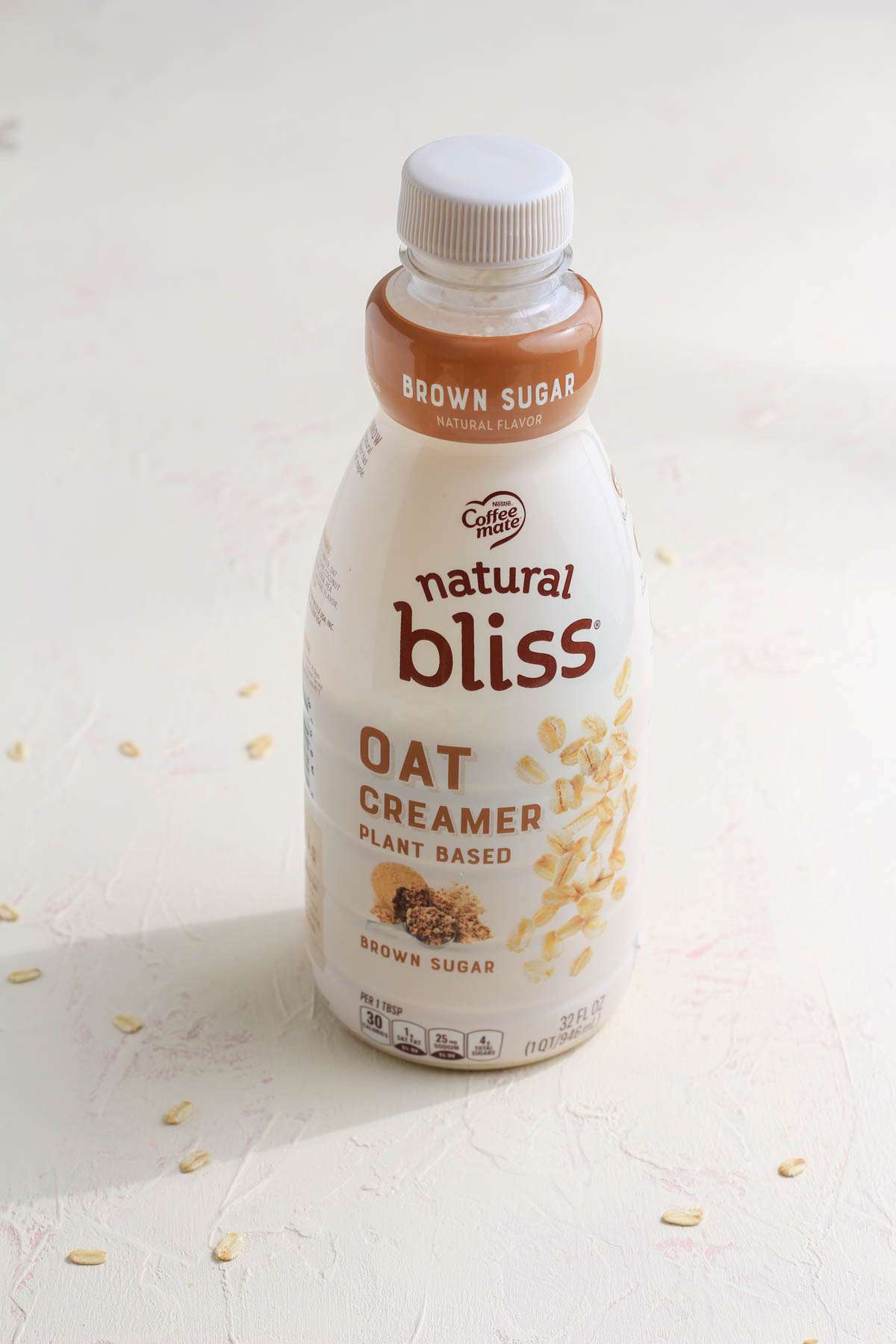 The front of a bottle of Natural Bliss Oat Creamer.