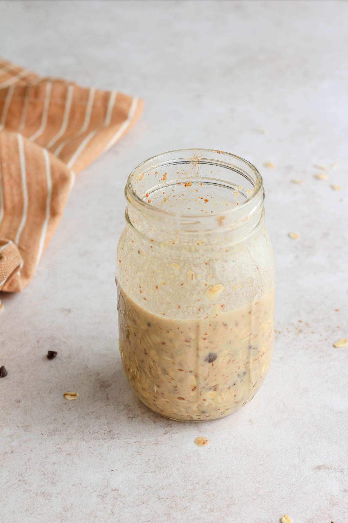 Peanut butter chocolate chip lactation overnight oats before setting in the fridge overnight.