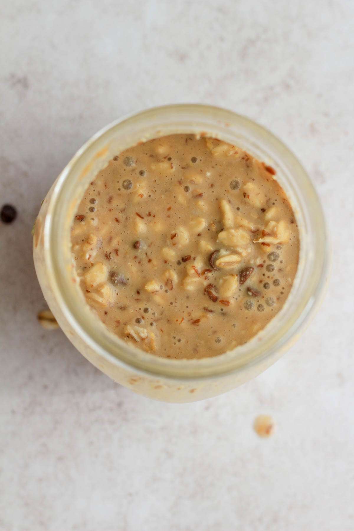 A top down of lactation overnight oats in a mason jar.